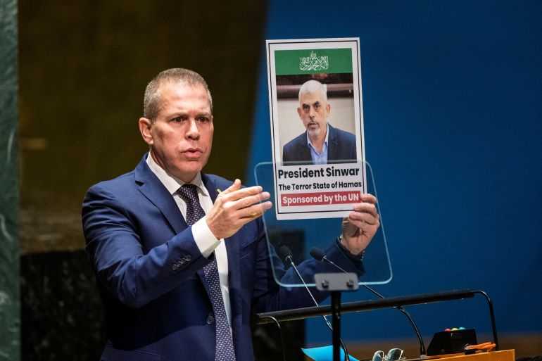 israel's ambassador to the united nations gilad erdan holds a picture of palestinian islamist group hamas' leader in gaza yahya sinwar, as he addresses delegates during the united nations general assembly before voting on a draft resolution that would recognize the palestinians as qualified to become a full u.n. member, in new york city, u.s. may 10, 2024. reuters/eduardo munoz