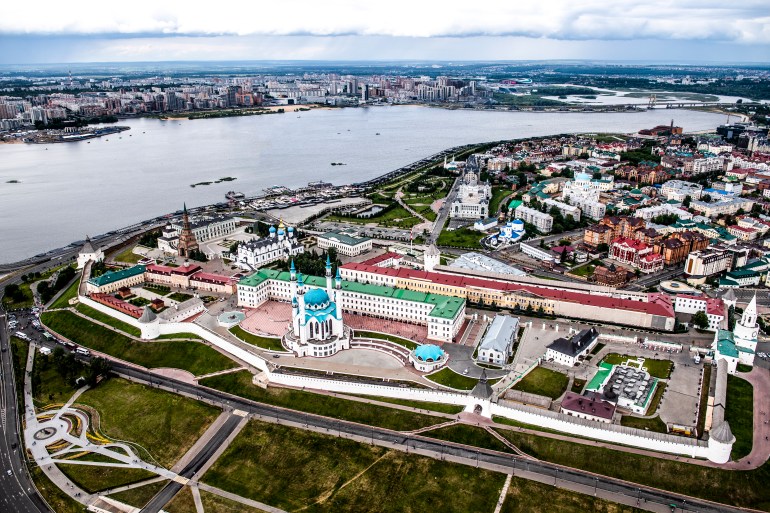 drone point of view of volga river and kremlin with it's white walls in kazan, republic of tatarstan's capital city, russia.