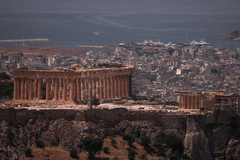 a view of the parthenon temple as the acropolis hill archaeological site is closed to visitors due to a heatwave hitting athens, greece, june 12, 2024. reuters/alkis konstantinidis