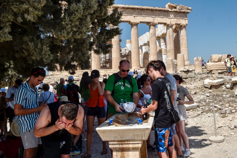 intensifying heatwave forces acropolis to reduce opening hours in athens after warning issued