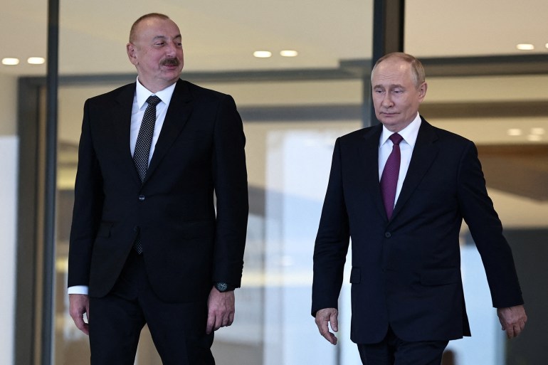 russia's president vladimir putin and azerbaijan's president ilham aliyev leave after a state reception at the gulustan palace in baku, azerbaijan august 19, 2024. sputnik/mikhail tereshchenko/pool via reuters attention editors - this image was provided by a third party.