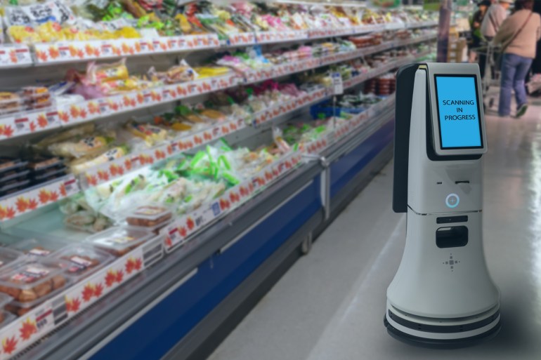 smart retail concept, robot service use for check the data of or stores that stock goods on shelves with easily-viewed barcode and prices or photo compared against an idealized representation of store شترستوك