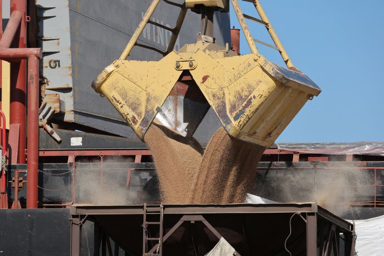 a crane unloads wheat from a cargo ship at beirut's port, lebanon, february 17, 2023. reuters/mohamed azakir