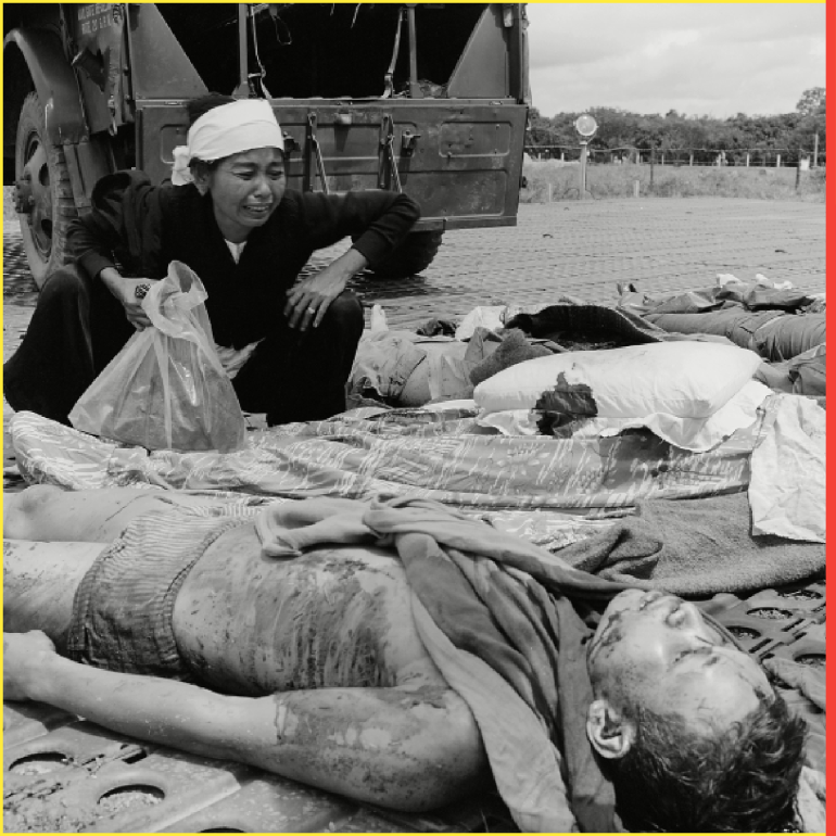 vietnam war. south vietnamese soldiers widow weeps over the body of her husband, one of the south vietnamese army casualties suffered in the war with the viet cong. 1965.