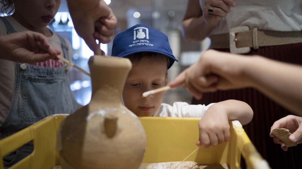 An Israeli boy who broke an ancient jar learns how the museum is piecing it back together