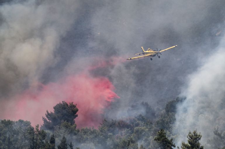 safed, israel - september 25: smoke rises as aerial extinguishing works continue with an aircraft over forest after rocket attacks from lebanon has struck in safed, israel on september 25, 2024. (photo by mostafa alkharouf/anadolu via getty images)