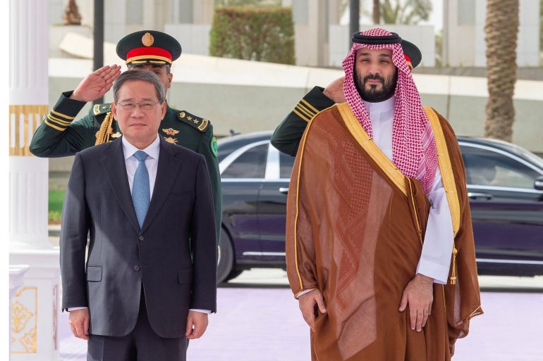 a handout picture provided by the saudi press agency (spa) shows saudi crown prince mohammed bin salman welcoming chinese prime minister li qiang in riyadh, on september 11, 2024. (photo by spa / afp) / === restricted to editorial use - mandatory credit "afp photo / ho / spa" - no marketing no advertising campaigns - distributed as a service to clients ===