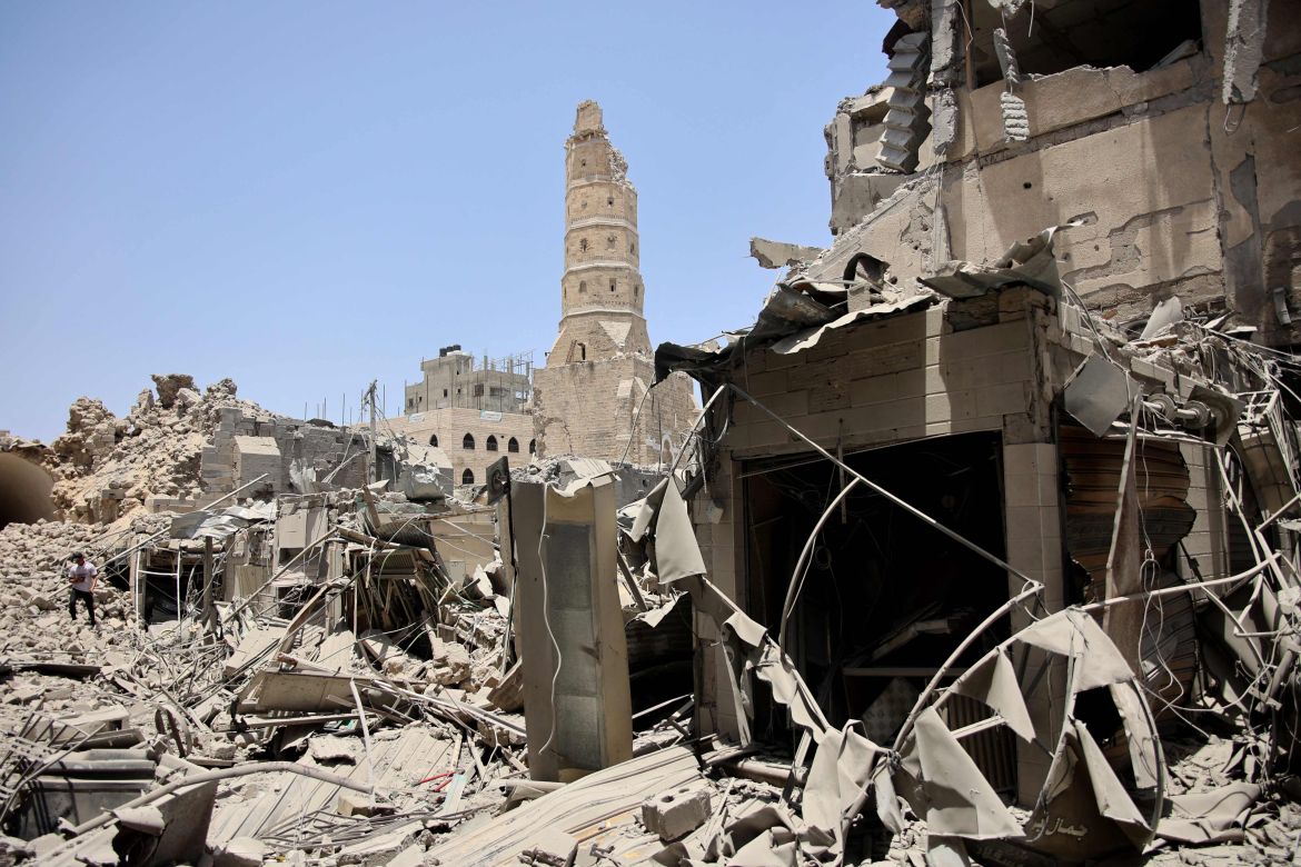 a man walks on the rubble of destroyed buildings following israeli bombardment near to the great omari mosque in the old city of gaza city, which leads to the historical qaysariyya market and gold shops, in gaza city on july 4, 2024, amid the ongoing conflict between israel and the palestinian hamas militant group. (photo by omar al-qattaa / afp)