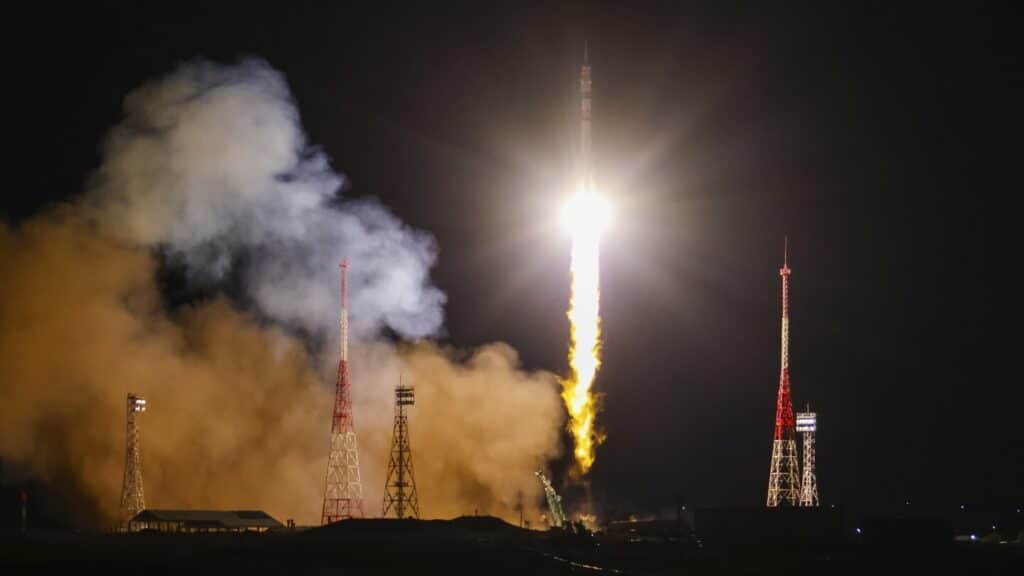 A Soyuz craft with 2 Russians and 1 American docks at the International Space Station