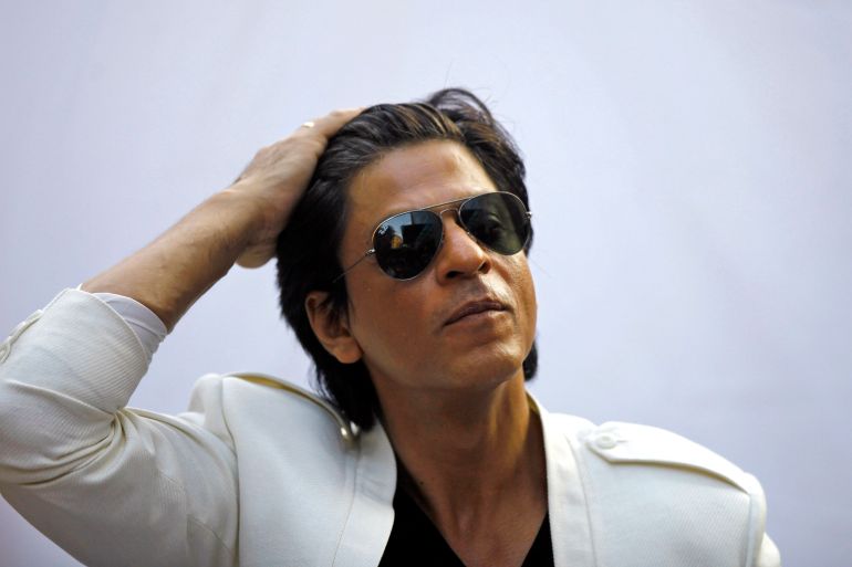 Bollywood superstar Shah Rukh Khan gestures as he speaks to the media outside his home on his birthday in Mumbai, India, Friday, Nov. 2, 2012. (AP Photo/Rafiq Maqbool)