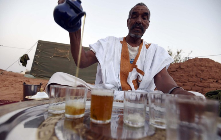 A Sahrawi refugee prepares tea