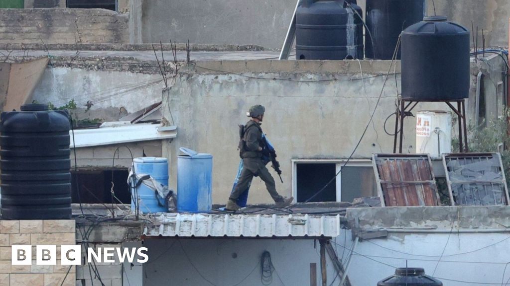 Israel investigates after its soldiers filmed throwing bodies off roof