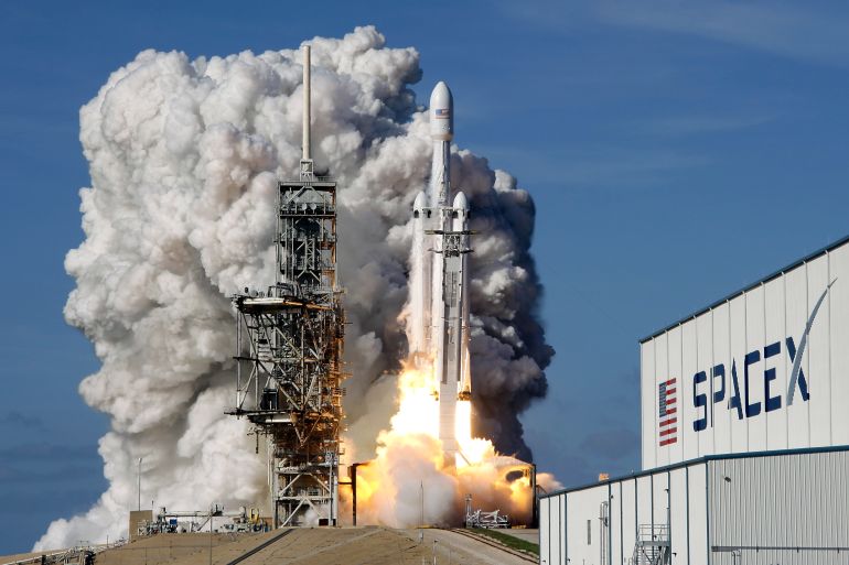 a falcon 9 spacex heavy rocket lifts off from pad 39a at the kennedy space center in cape canaveral, fla., tuesday, feb. 6, 2018. the falcon heavy, has three first-stage boosters, strapped together with 27 engines in all. (ap photo/john raoux)