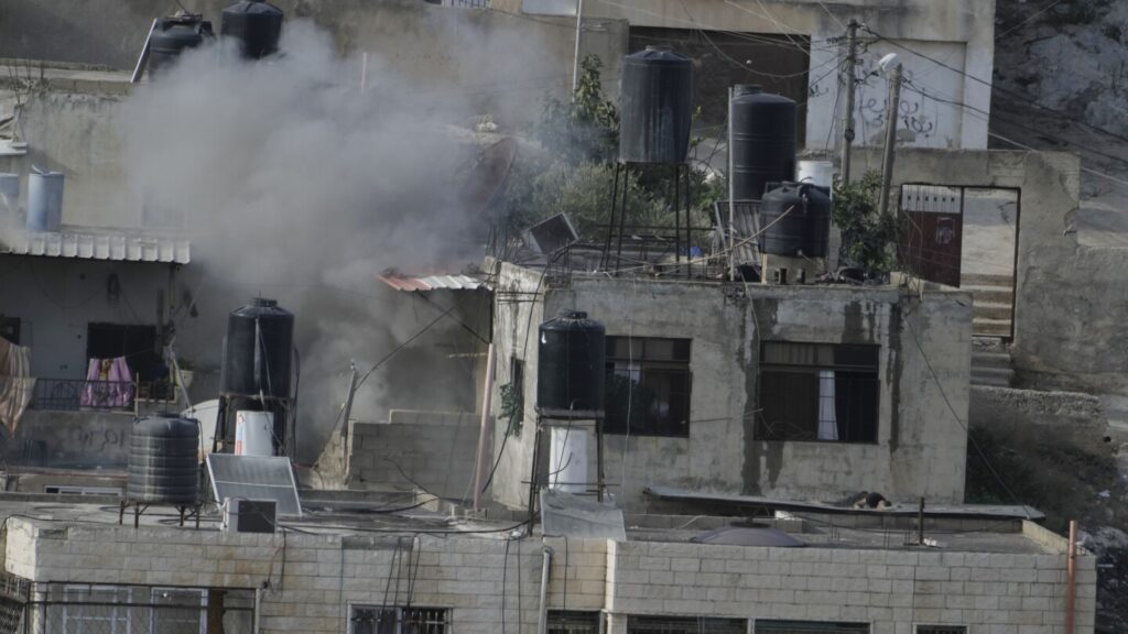 Israeli soldiers pushed three apparently lifeless bodies from roofs during a West Bank raid