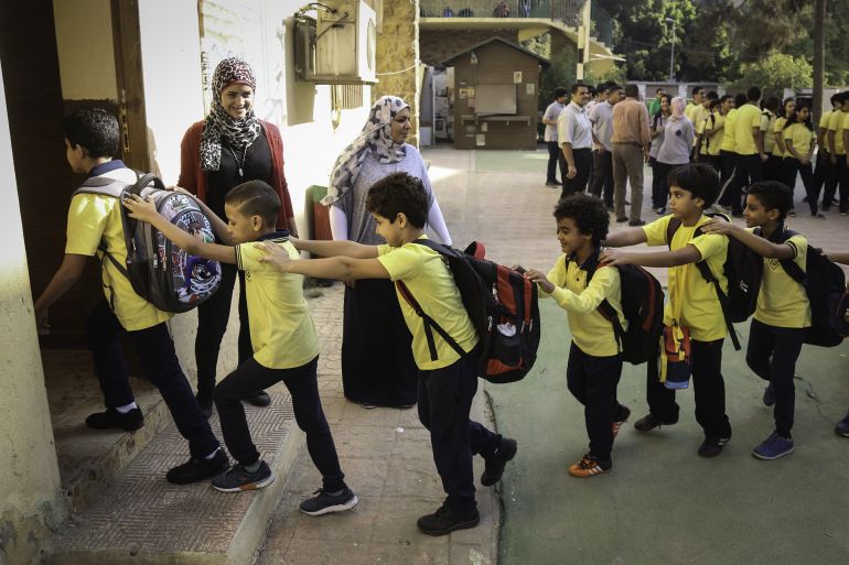 cairo, egypt - september 25: egyptian students go to their classroom after singing their national anthem as egyptian education minister al-hilali al- sherbini (not seen) arrives to inspect the regulations of the new school year at al nasir schools at cairo's southern district maadi, egypt on september 25, 2016.