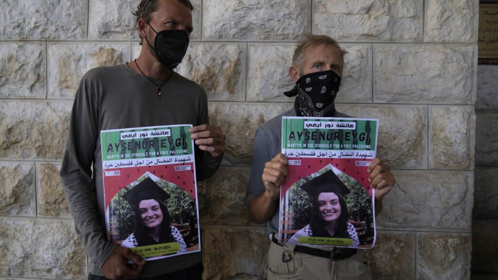 Mourners attend funeral for American activist witness says was shot dead by Israeli troops