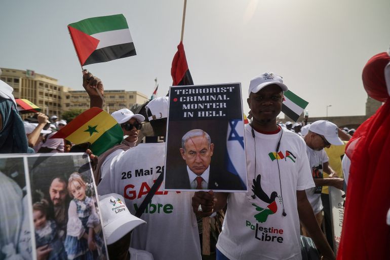 a man takes part in a protest in solidarity with palestinians and gaza, organised by civil society group (amgrc) in dakar, senegal may 26, 2024.reuters/zohra bensemra