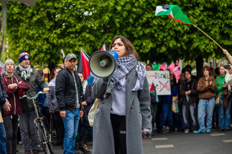 dublin, ireland - may 4 2024 a speaker addressing a protest crowd on o'connell street, before heading to trinity college to support the student bds encampment due to the college's ties with israel