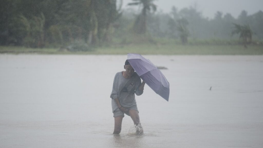 Tropical storm battering Philippines leaves at least 24 people dead in flooding and landslides