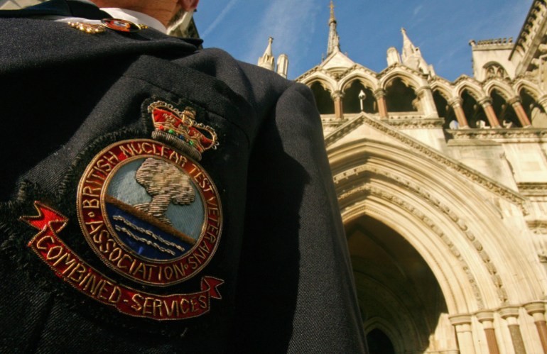 a british nuclear test veteran stands outside the high court, in london, on january 21, 2009. veterans of british nuclear tests in the south pacific launched a bid for compensation at london's high court wednesday, claiming they suffered health problems due to the 1950s tests. the 970 ex-servicemen from britain, new zealand and fiji claim they have suffered illnesses -- including cancer, fertility problems and skin defects -- due to exposure to atomic weapons radiation fall-out. afp photo/carl de souza (photo credit should read carl de souza/afp via getty images)