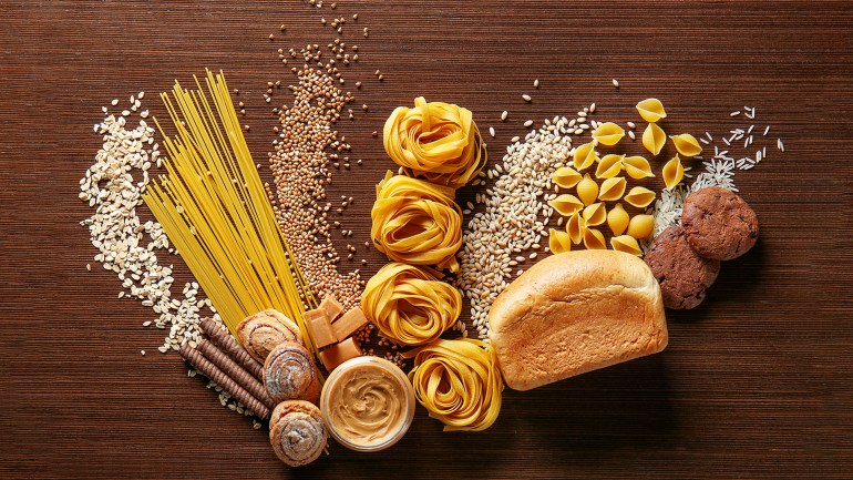 كربوهيدرات carbohydrate set of products with complex carbohydrates on wooden background shutterstock_523563058