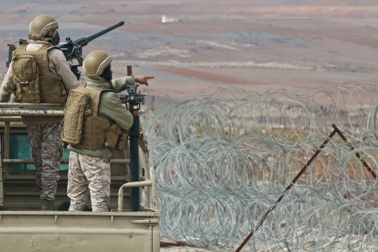 a picture taken during a tour origanized by the jordanian army shows soldiers patrolling along the border with syria to prevent trafficking, on february 17, 2022. - drug trafficking from syria into jordan is becoming "organised" with smugglers stepping up operations and using sophisticated equipment including drones, jordan's army said, warning of a shoot-to-kill policy. since the beginning of this year, jordan's army has killed 30 smugglers and foiled attempts to smuggle into the kingdom from syria 16 million captagon pills -- more than they seized in the whole of 2021 -- the military said. (photo by khalil mazraawi / afp)