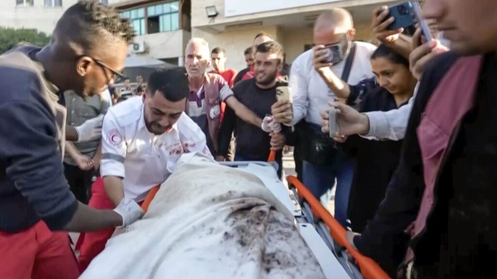 A Gaza medic realizes he’s carrying his own mother’s body, killed by an Israeli airstrike