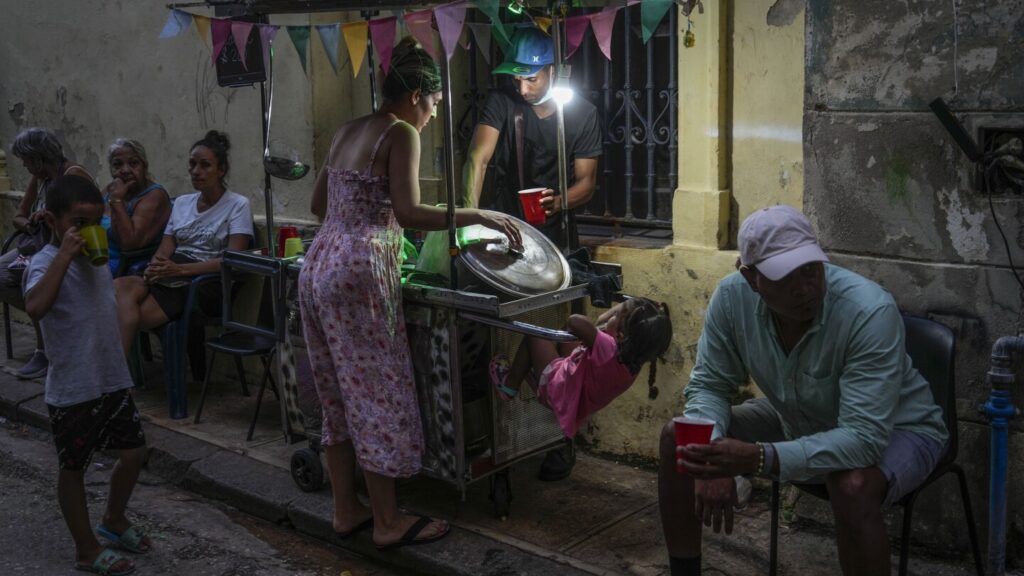 Cuba fights to come back from a nationwide blackout, then a storm that killed six