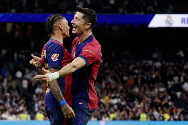 madrid, spain - october 26: raphinha of fc barcelona celebrates 0-4 with robert lewandowski of fc barcelona during the laliga ea sports match between real madrid v fc barcelona at the estadio santiago bernabeu on october 26, 2024 in madrid spain (photo by maria gracia jimenez/soccrates/getty images)