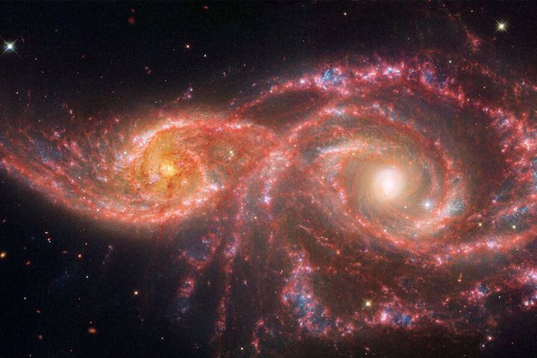 "galaxies ic 2163 and ngc 2207 "المصدر (ناسا)