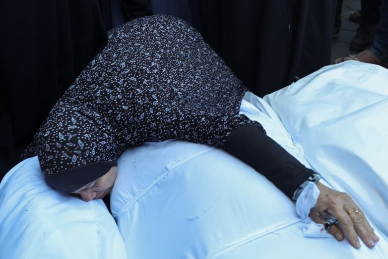 a mourner reacts during the funeral of palestinians killed in an israeli strike, at al-aqsa martyrs hospital in deir al-balah, in the central gaza strip, november 17, 2024. reuters/ramadan abed