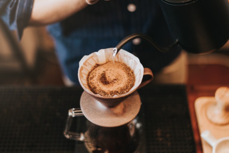 barista preparing drip coffee