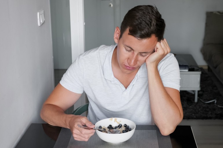 sunburned man at table