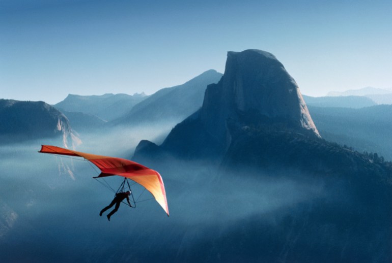 hang gliding over yosemite valley - stock photo