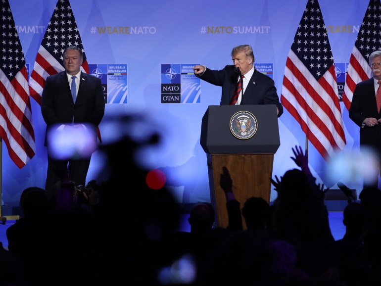 brussels, belgium - july 12: u.s. president donald trump, flanked by u.s. secretary of state mike pompeo (l) and national security advisor john bolton, speaks to the media at a press conference on the second day of the 2018 nato summit on july 12, 2018 in brussels, belgium. leaders from nato member and partner states are meeting for a two-day summit, which is being overshadowed by strong demands by u.s. president trump for most nato member countries to spend more on de