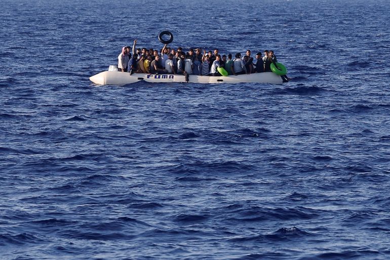 Migrants onboard a rubber boat ask for help near NGO Open Arms rescue boat "Astral" in international waters south of Lampedusa, in the central Mediterranean Sea, August 13, 2024. REUTERS/Juan Medina