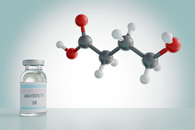 3d molecular model of gamma-hydroxybutyrate (ghb) alongside a small vial labeled "gamma-hydroxybutyrate (ghb)."