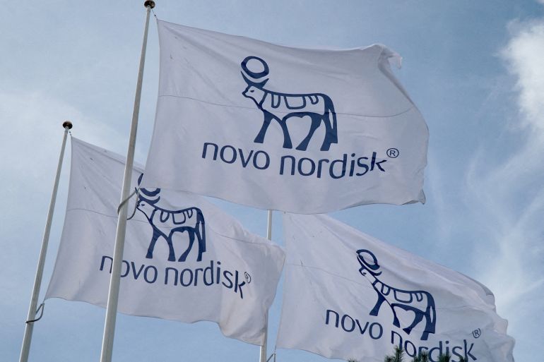 Flags with the Novo Nordisk logo flutter outside their Danish company's offices in Copenhagen, Denmark, September 26, 2023. REUTERS/Tom Little REFILE - CORRECTING LOCATION