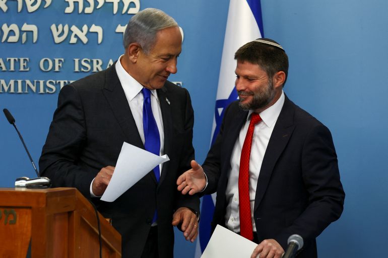 Israeli Prime Minister Benjamin Netanyahu and Finance Minister Bezalel Smotrich hold a news conference to present their plan for dealing with price increases in Israel's economy at the Prime Minister's office in Jerusalem, January 11, 2023. REUTERS/Ronen Zvulun