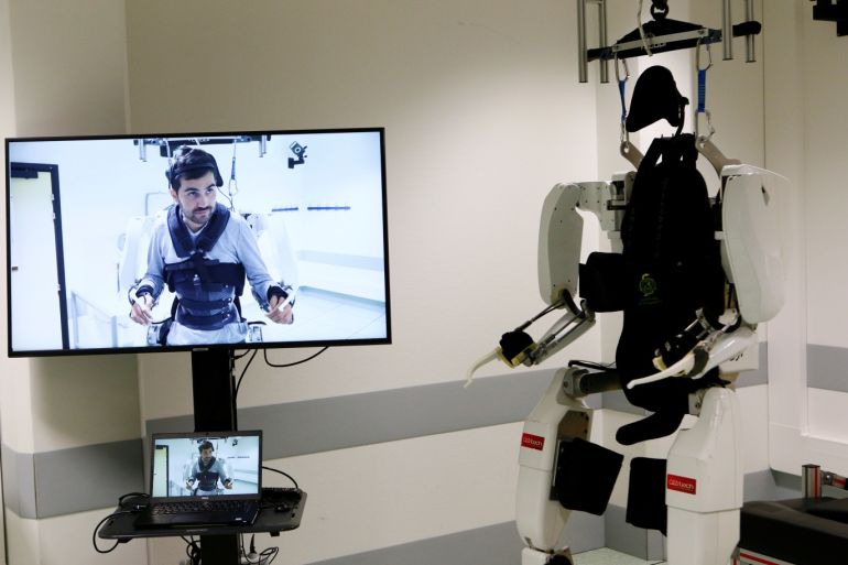 The pioneering four-limb robotic system, or exoskeleton, that is commanded and controlled by signals from the patient's brain is seen following a news conference after Thibault, a 28-year-old man, paralyzed from the shoulders down, had been able to walk using it at the French research center Clinatec in Grenoble, France, October 7, 2019. REUTERS/Emmanuel Foudrot