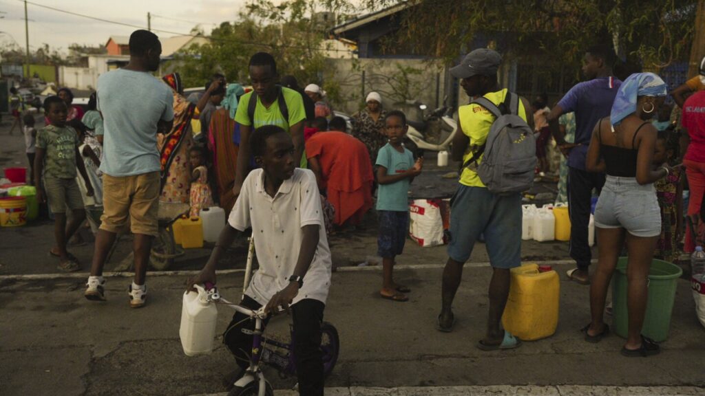 Families scramble to help after deadly cyclone rips through French territory of Mayotte off Africa