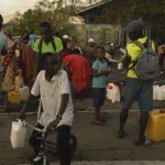 Families scramble to help after deadly cyclone rips through French territory of Mayotte off Africa