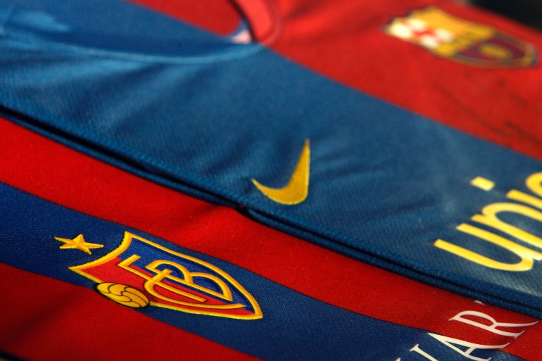 A FC Basel (FCB) jersey (L) is seen next to a Barcelona's jersey during an exhibition organised by the Swiss team ahead of their Champions League Group C encounter with Barca in Basel October 20, 2008. After years of inspiring football fans around the world, FC Barcelona will on Wednesday face the lesser-known Swiss club which claims to have been the inspiration behind the creation of the Spanish giants. Swiss champions FC Basel have organised an exhibition at their stadium museum ahead of the Champions League Group C encounter, showing how businessman and former Basel player Hans Gamper migrated to Spain before founding FC Barcelona in 1899. Photo taken October 20, 2008. To match feature SOCCER-CHAMPIONS/BARCELONA-BASEL REUTERS/Christian Hartmann (SWITZERLAND)