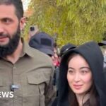 Syria rebel leader dismisses controversy over photo with woman