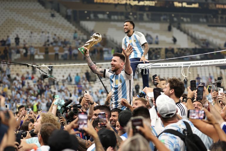 LUSAIL CITY, QATAR - DECEMBER 18: Lionel Messi of Argentina celebrates with the FIFA World Cup Qatar 2022 Winner's Trophy during the FIFA World Cup Qatar 2022 Final match between Argentina and France at Lusail Stadium on December 18, 2022 in Lusail City, Qatar. (Photo by Julian Finney/Getty Images)