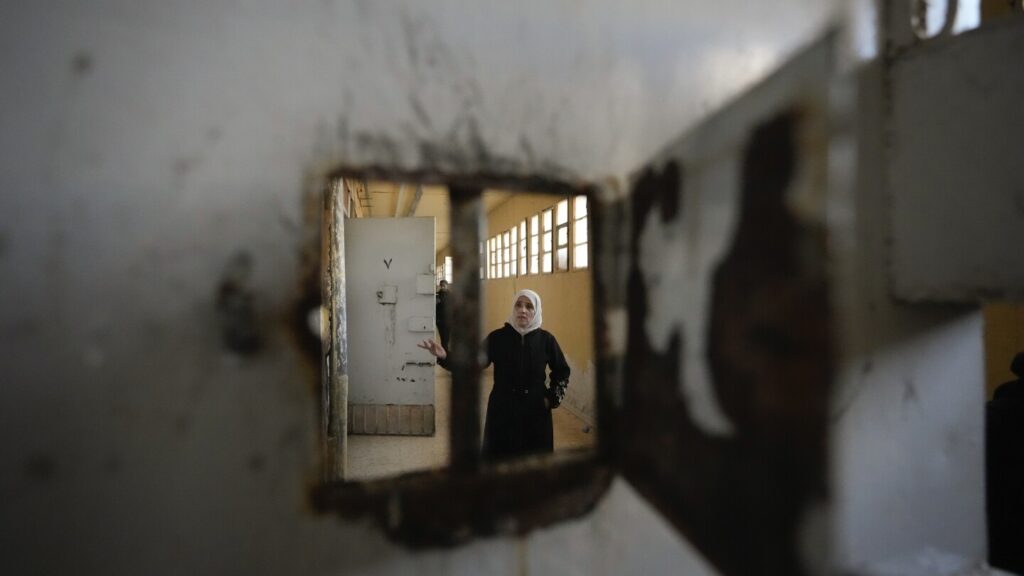 Thousands scour Syria’s most horrific prison but find no sign of their loved ones