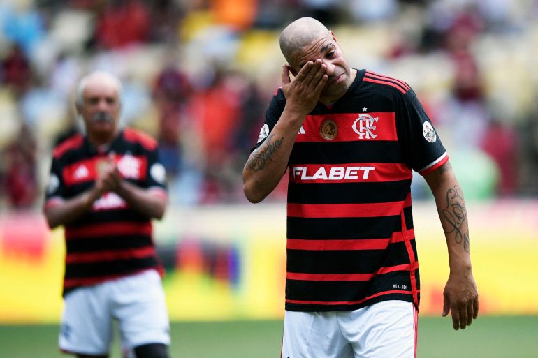 Brazilian former football player Adriano cries during his friendly farewell match with legends of Brazil's Flamengo and Italy's Inter Milan at Maracana Stadium in Rio de Janeiro on December 15, 2024. (Photo by Daniel RAMALHO / AFP)