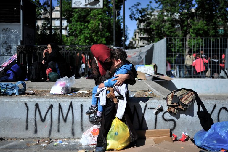 A young woman from Afghanistan comforts her child in victoria square where hundreds of refugees have found temporary shelter until they continue their trip in Athens,Greece.Thursday 01 October 2015. (Photo by Fotis Plegas G/NurPhoto) (Photo by NurPhoto/NurPhoto via Getty Images)