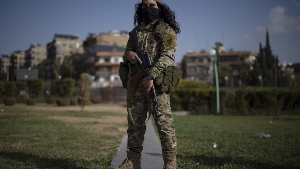 AP PHOTOS: Portraits of former Syrian rebels now soldiers