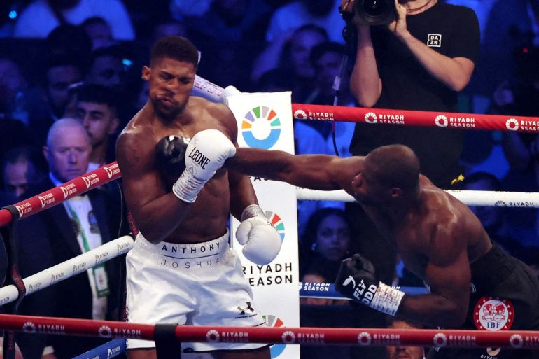 Boxing - Daniel Dubois v Anthony Joshua - IBF World Heavyweight Title - Wembley Stadium, London, Britain - September 21, 2024 Daniel Dubois knocks down Anthony Joshua Action Images via Reuters/Andrew Boyers TPX IMAGES OF THE DAY